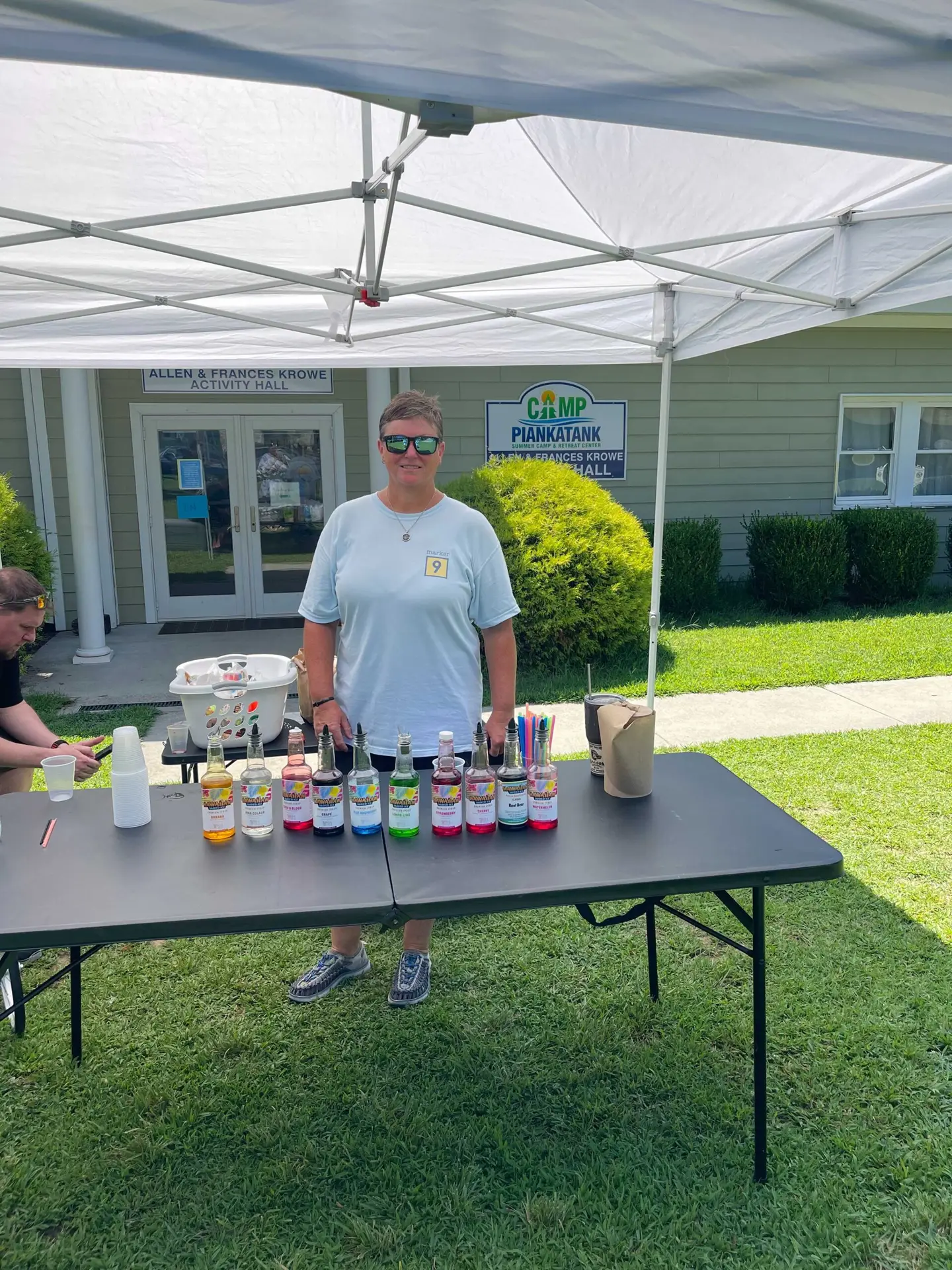 Kristen Schomburg at the snow cone table at Camp Piankatank